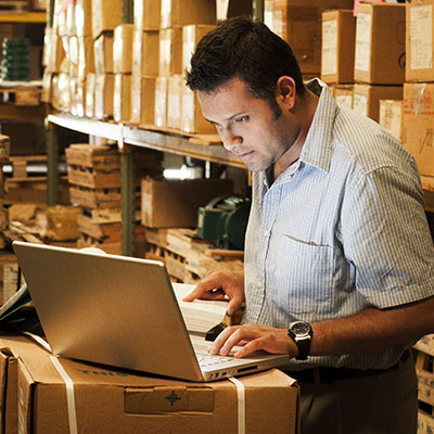 Businessman surrounded by boxes
